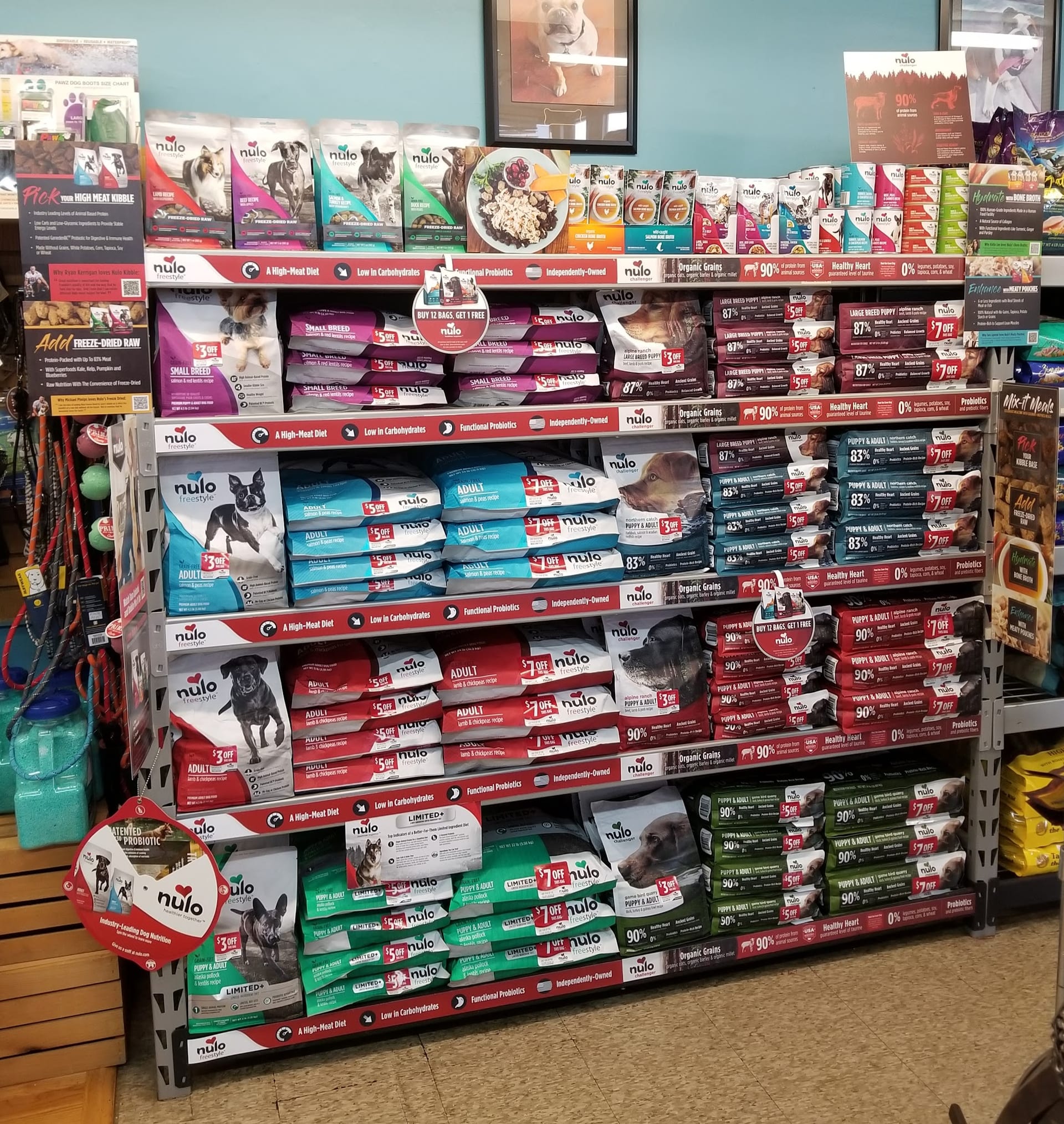 Nulo Freestyle dog food products filling a large retail store shelf