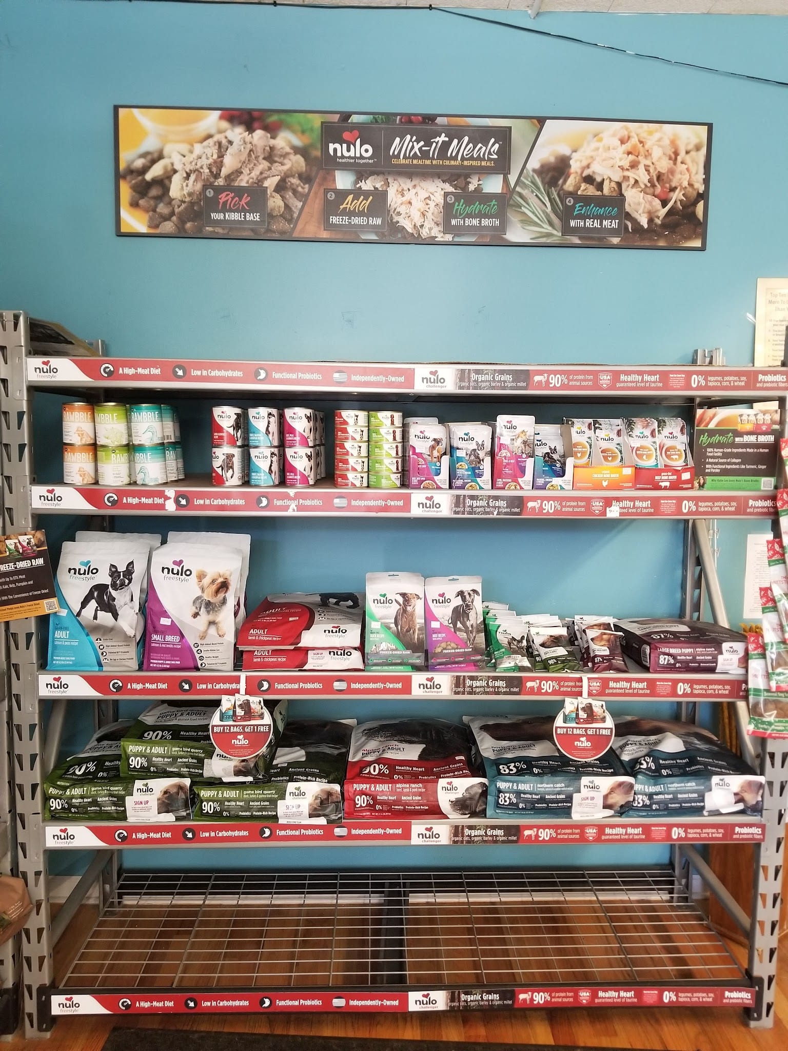 Nulo brand dog food products displayed on retail shelves in pet store
