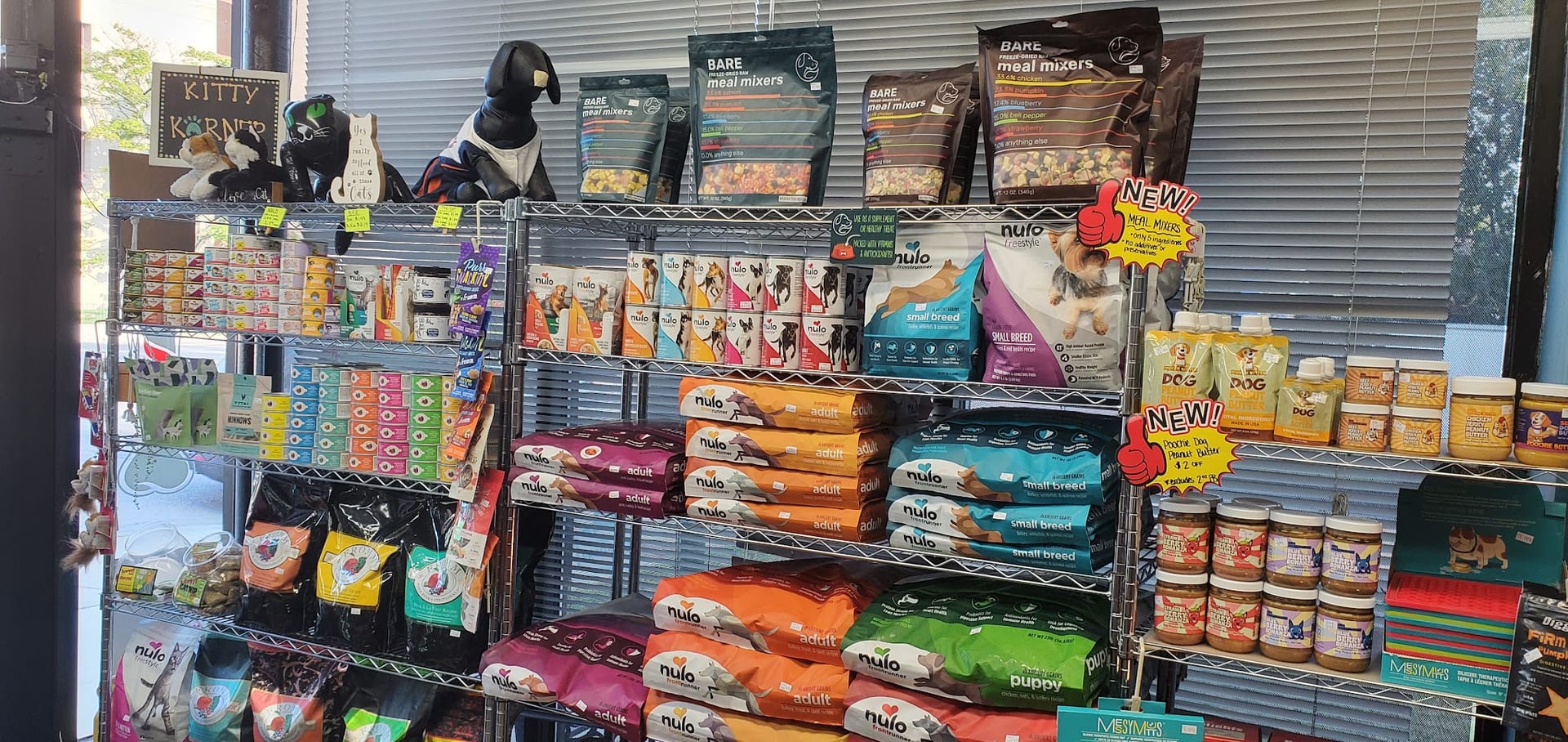 Pet store shelves stocked with Nulo dog food and BARE meal mixers